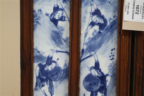 A 19th century Chinese blue and white porcelain panelled screen length 136cm